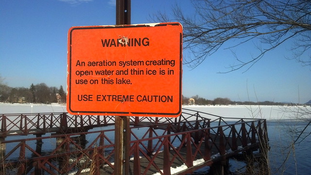 Sign: Warning: An aeration system creating open water and thin ice is in use on this lake. USE EXTREME CAUTION.